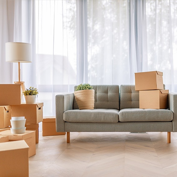 boxes stacked on the floor of a new home