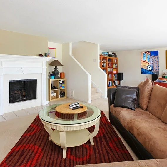 clean relaxing basement with fireplace