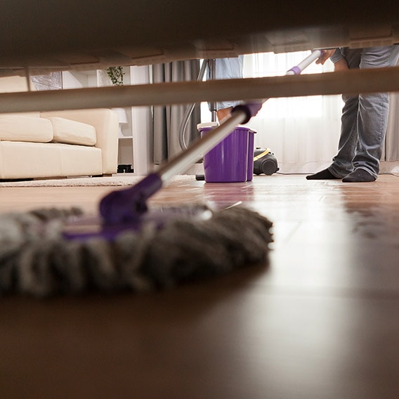 cleaning dust from under furniture