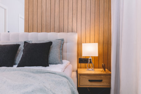 Small cozy bedroom with comfortable bed