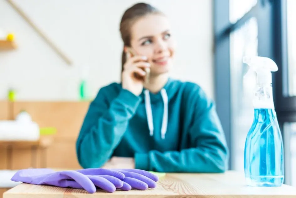 Woman interviewing Cambridge, Ontario house cleaners over the phone